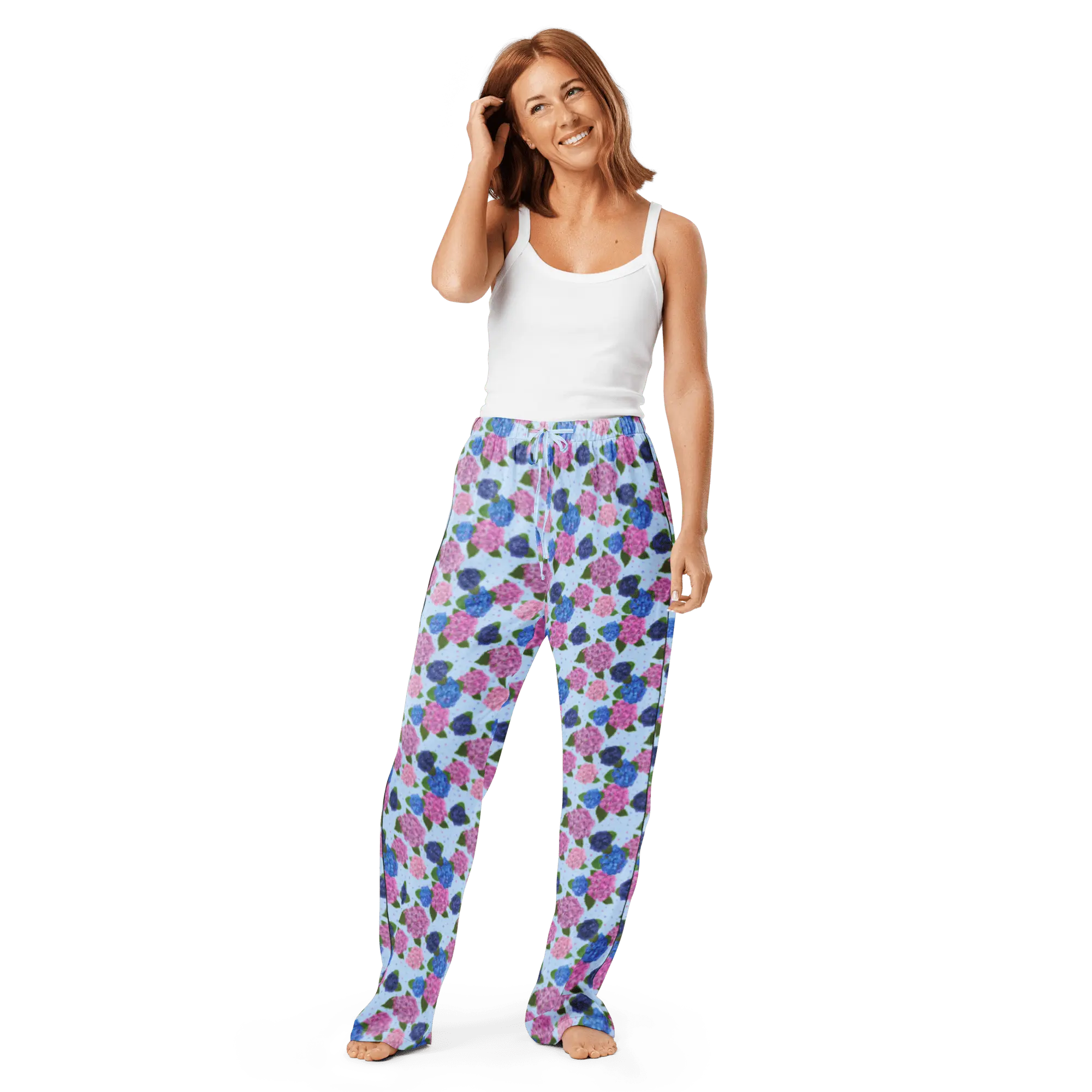 Woman wearing Happy Hydrangea watercolor pajama pants, Main Street Collective loungewear.