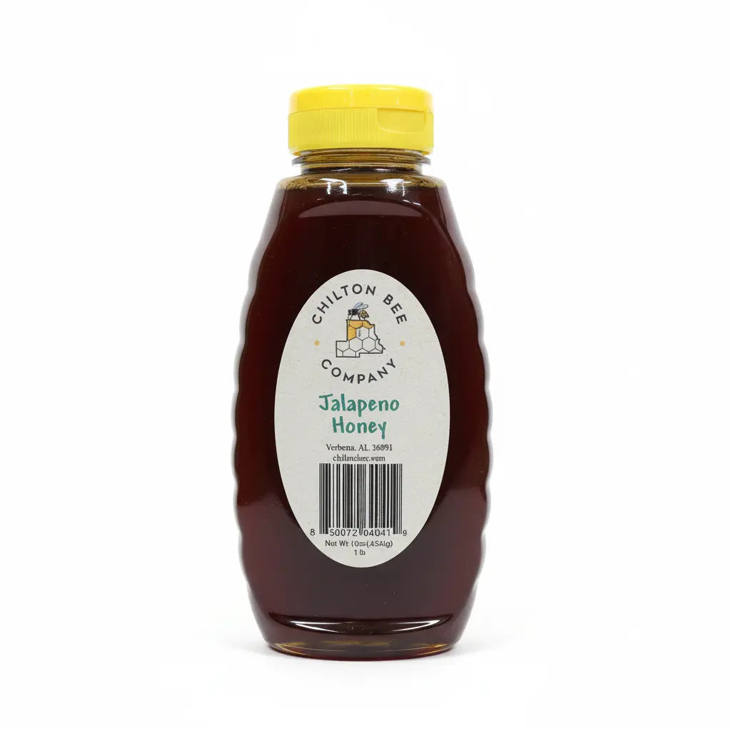 Bottle of Chilton Bee Company Jalapeno Honey with a yellow lid and a label, on a white background.