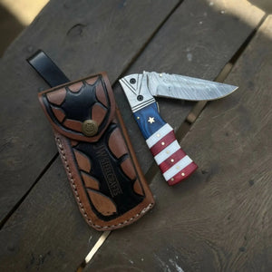 Damascus Folding Pocket Knife — American Flag Handle, Damascus Bolster, Linear Lock & Hand Engraved Leather Sheath