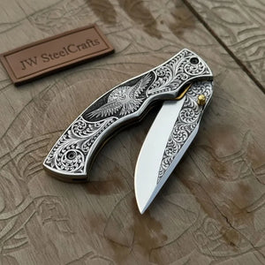Hand Engraved Folding Knife — Eagle Motif Stainless Steel Scales, Mirror Polish Blade, Liner Lock, Wooden Box & Viking Rune Bracelet