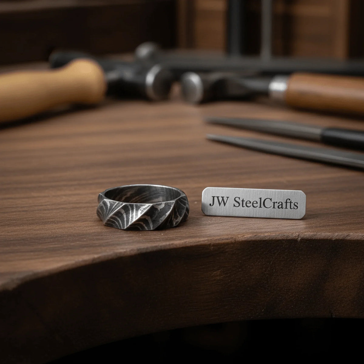 Geometric Damascus Faceted Ring with Twisted Multi-Facet Design detail view by JW SteelCrafts