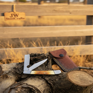 Razor Trapper Knife with Burned Bone Handle and Steel Bolsters detail view by JW SteelCrafts