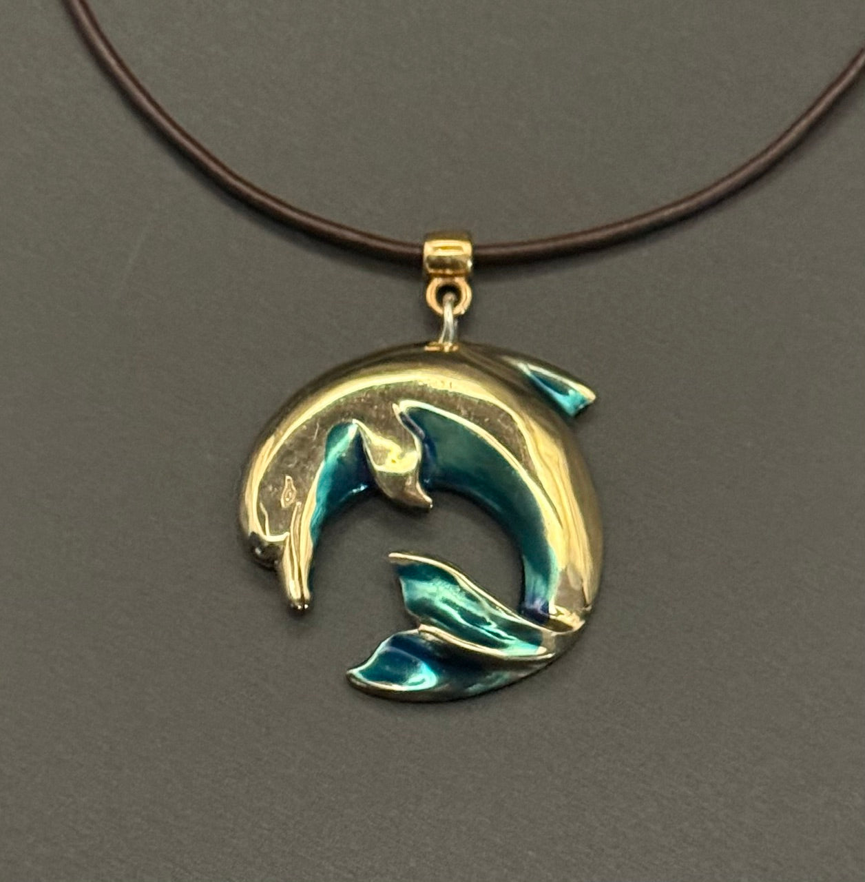 Bronze Curved Dolphin with blue patina