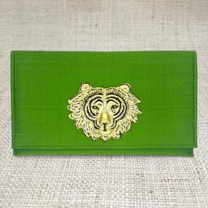 Green silk clutch with gold tiger head embellishment