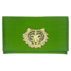 Green silk clutch with gold tiger face emblem
