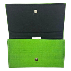 Green silk clutch purse with gold square magnetic snap closure, open view.