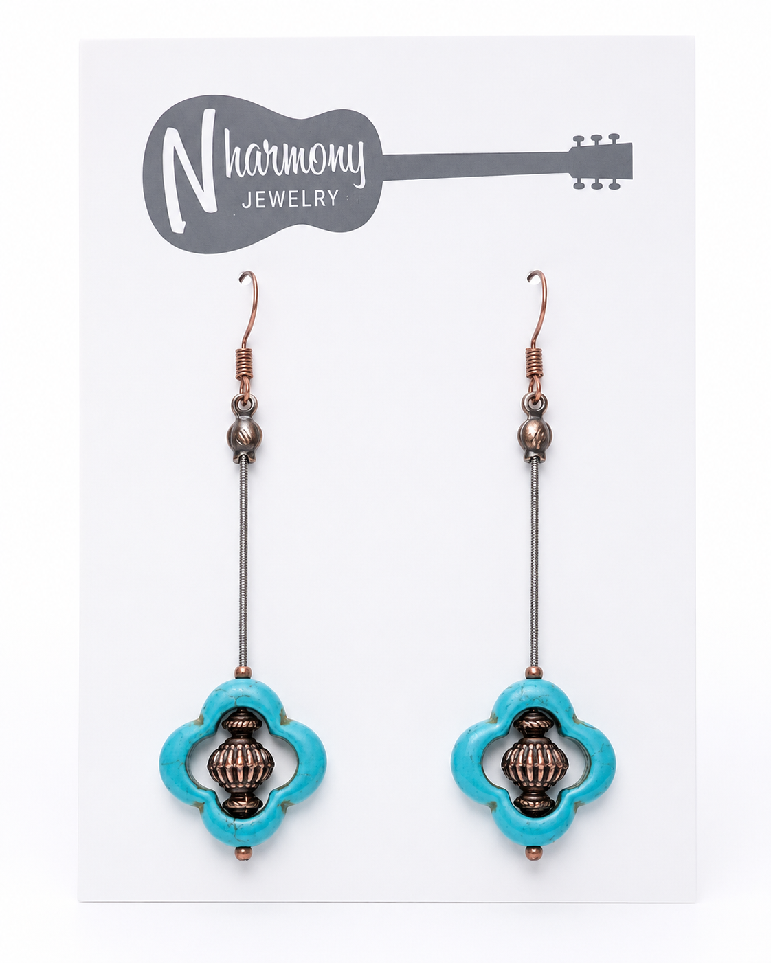 Turquoise earrings with intricate designs on a 'N Harmony Jewelry' card.