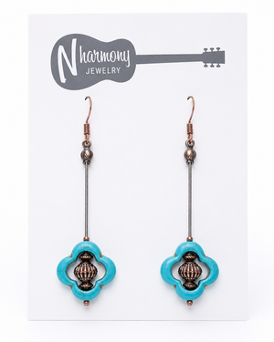 Turquoise earrings with intricate designs on a 'N Harmony Jewelry' card.