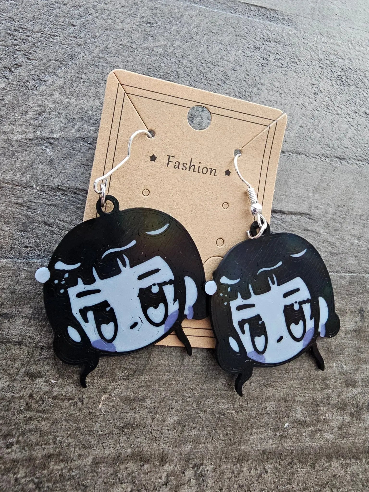 K-Pop Demon Hunter Earrings - Zoey Chibi Anime Style - Main Street Collective. Bold Black & Gray Anime Character Earrings.