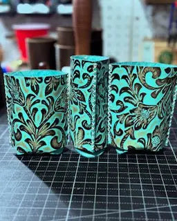 Custom Leather Koozies: Can, Slim Can, & Bottle Holders with Floral Design - Main Street Collective. Keep your drinks cold in style!