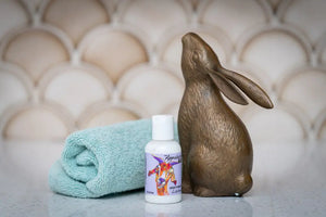 Appalachian GOAT'S MILK LAVENDER LOTION with rolled towel and bunny statue