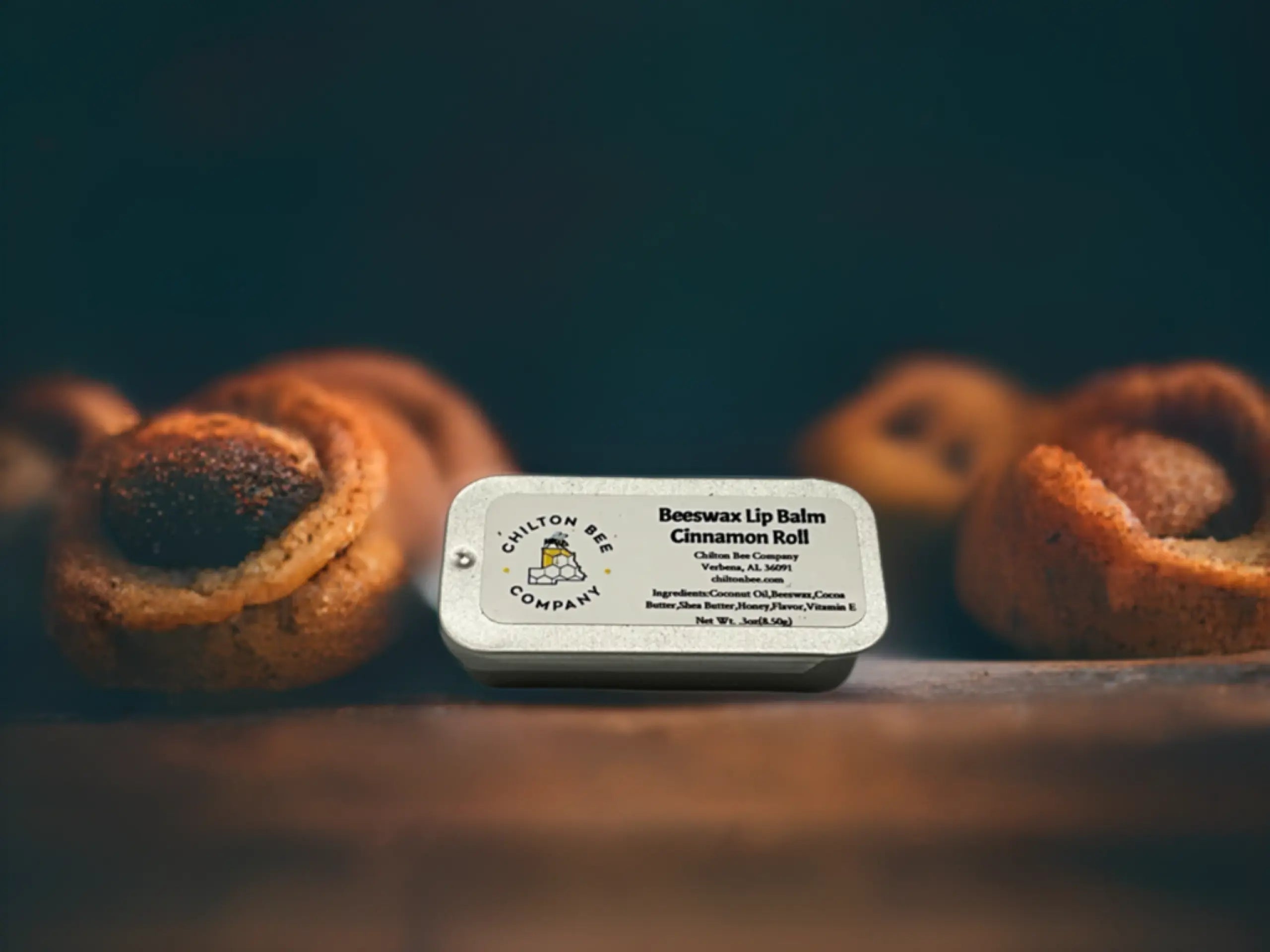 Chilton Bee Company cinnamon roll beeswax lip balm in a tin.