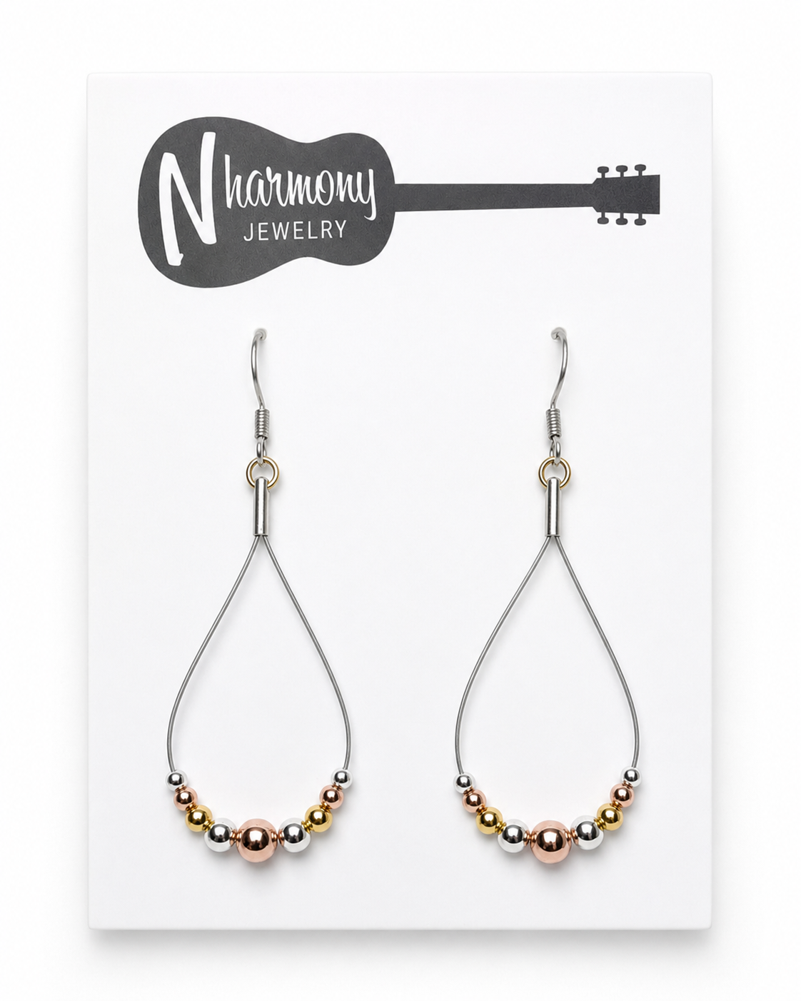 Teardrop-shaped earrings with multicolored beads on a Harmony Jewelry card.
