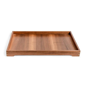 Rectangular wooden tray with raised edges and brass inlay detail on a white background.