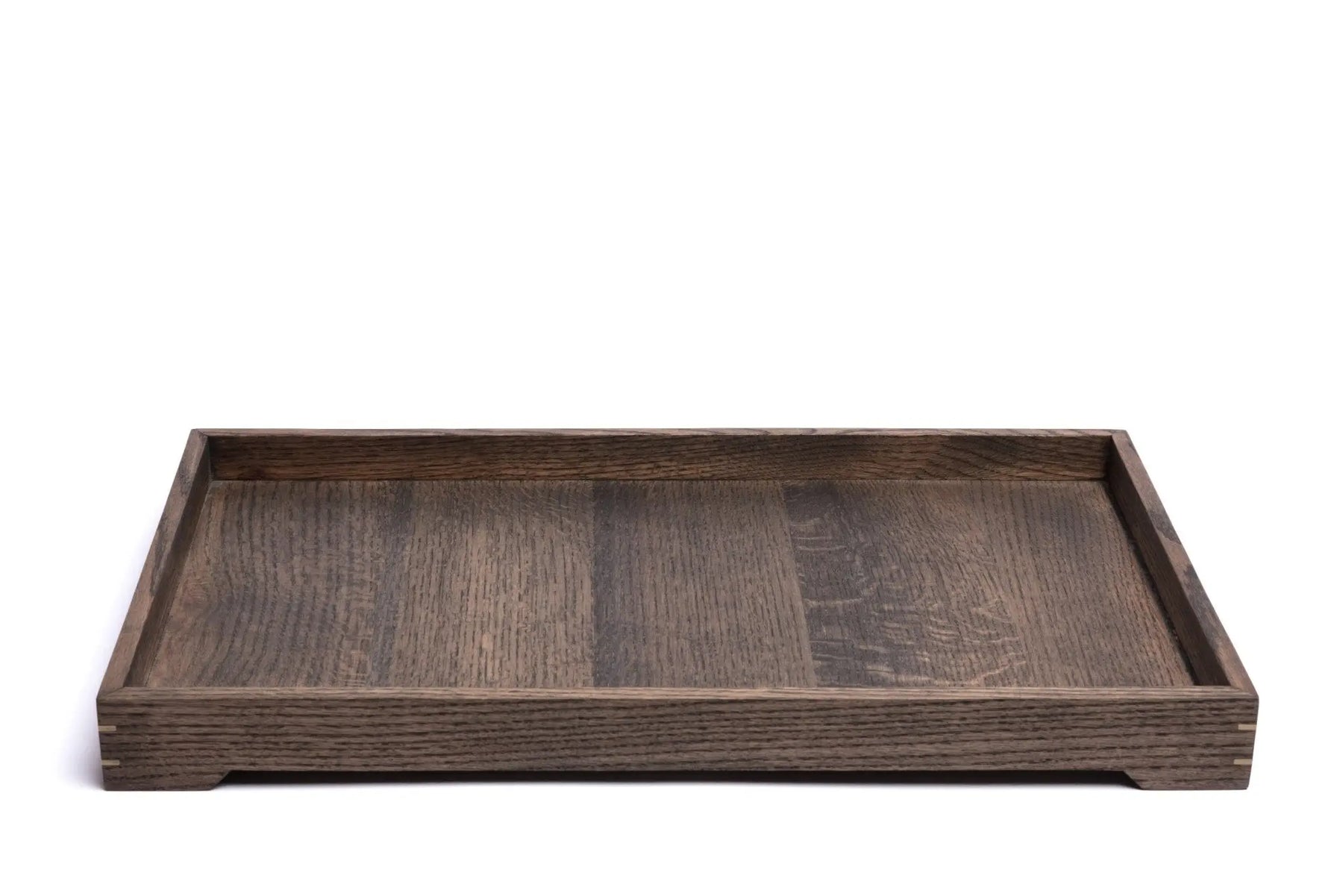 Dark wood tray with visible wood grain and brass accents on a white background. The tray has short legs.