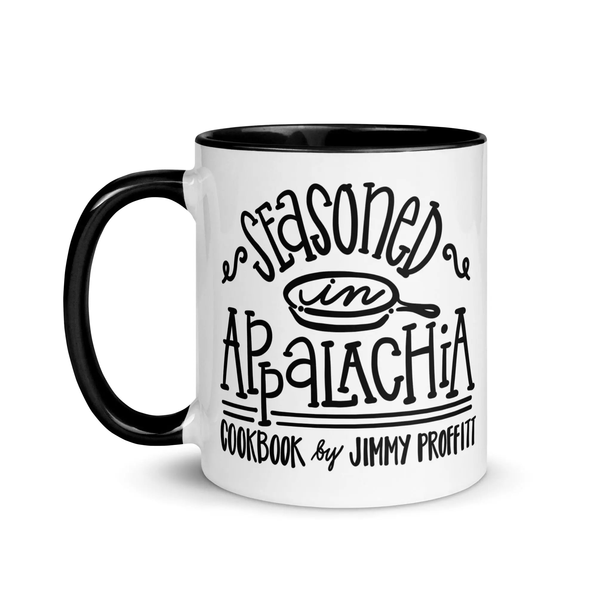 Black handle mug with 'Seasoned in Appalachia' cookbook design by Jimmy Proffitt from Main Street Collective