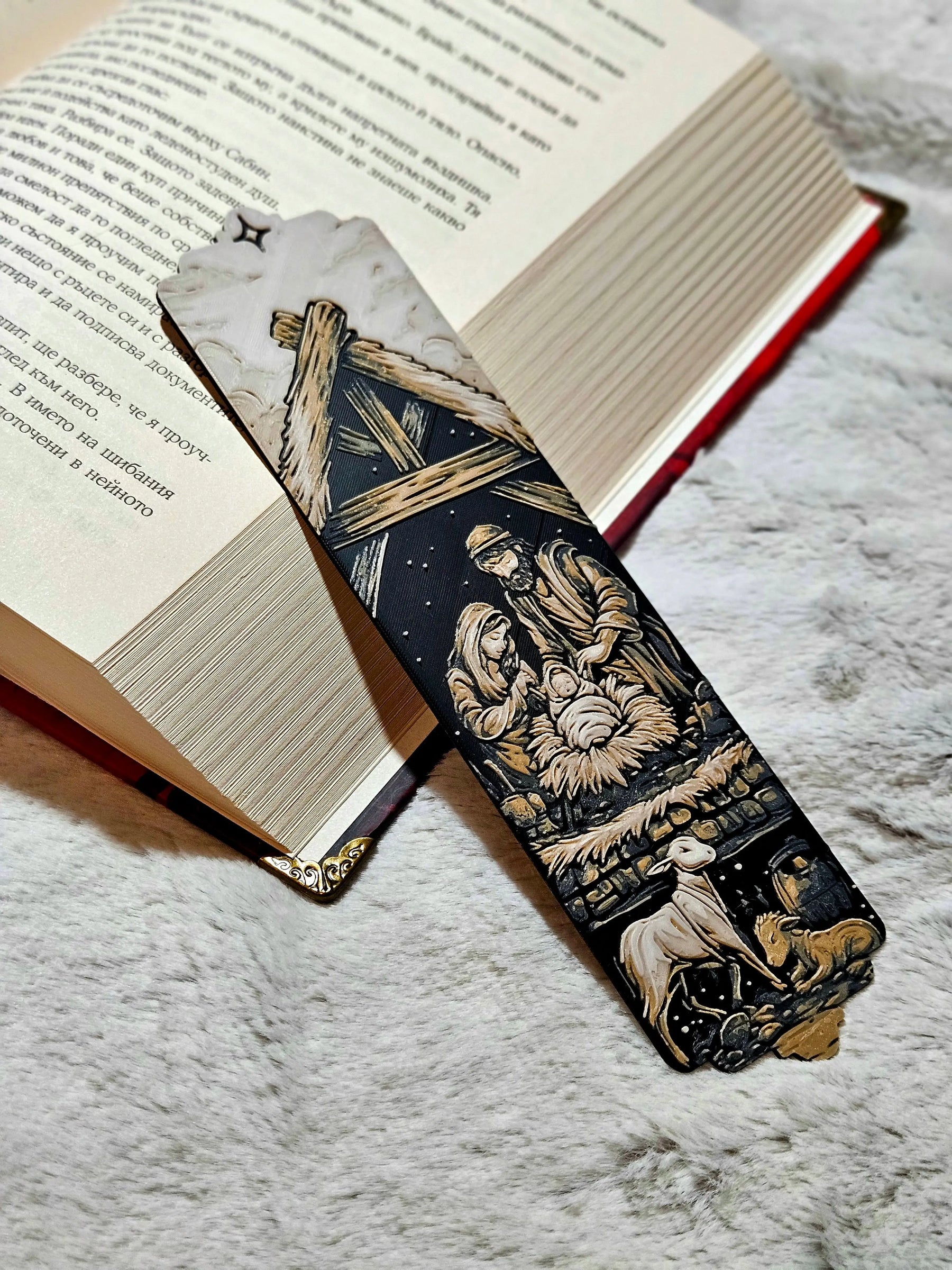 Nativity Scene Christmas Bookmark: Holy Family with baby Jesus, Mary, and Joseph in stable under star.