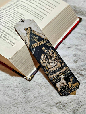 Nativity Scene Christmas Bookmark: Holy Family with baby Jesus, Mary, and Joseph in stable under star.
