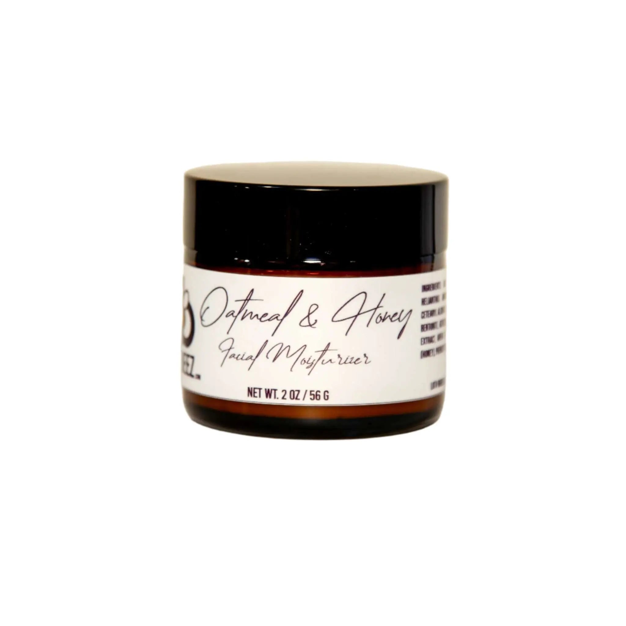 Oatmeal and honey facial moisturizer jar with black lid, skin care product.