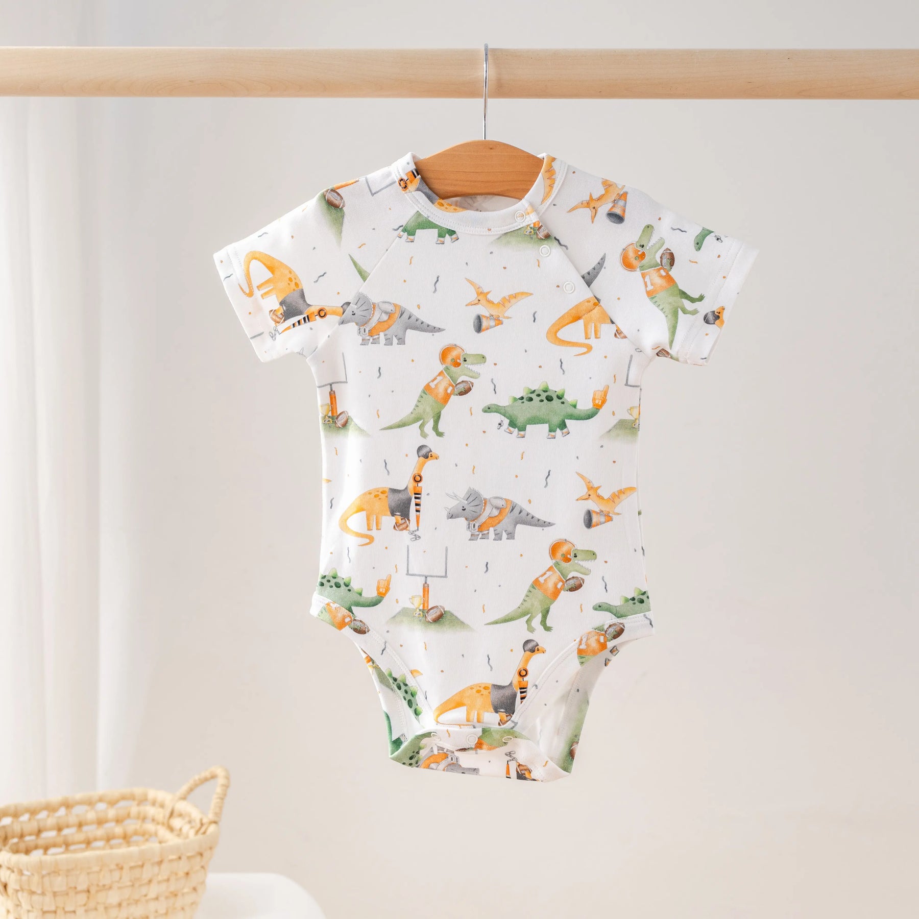 Orange Dino All-Stars Organic Cotton Onesie by Nola Tawk, Southern lifestyle apparel main product photo