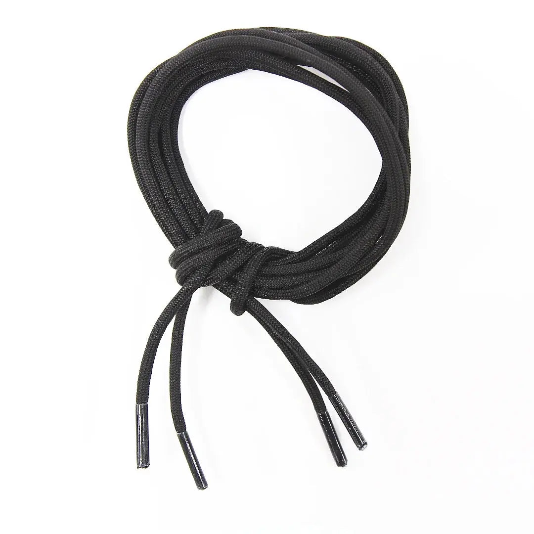 Black paracord boot laces coiled with plastic tips.