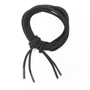 Black paracord boot laces coiled with plastic tips.
