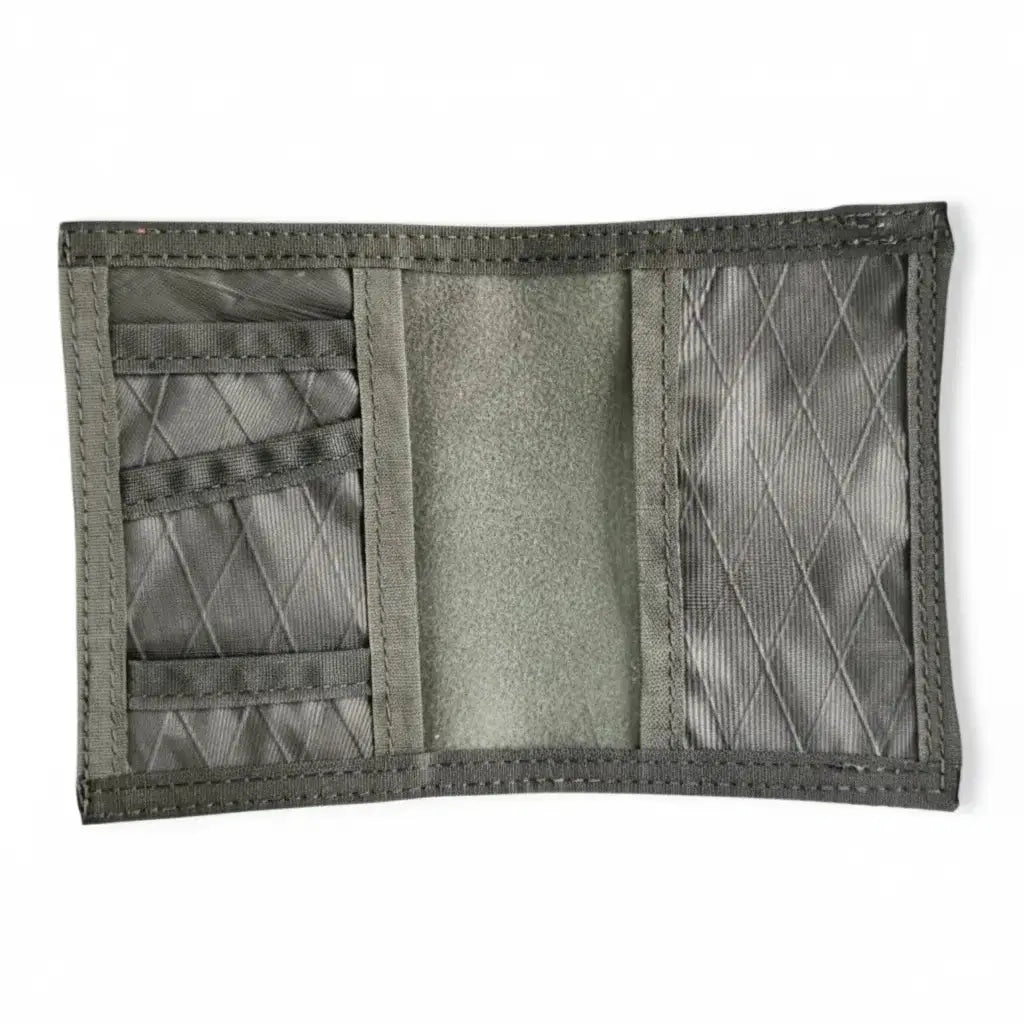 Open gray fabric passport notebook wallet with multiple internal card slots.