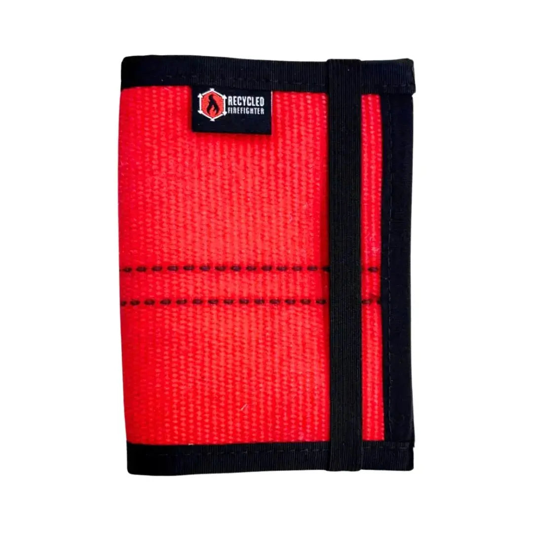 Red recycled firefighter hose passport wallet with black elastic strap and logo
