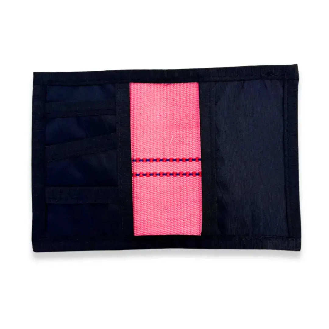 Pink firehose wallet with black exterior and card slots shown open.