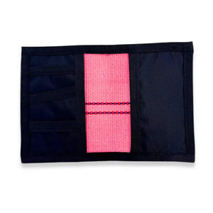Pink firehose wallet with black exterior and card slots shown open.