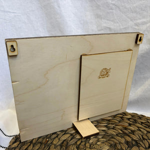 Personalized wooden picture frame with love quote and photo space, showcasing its desktop stand and hanging hardware.