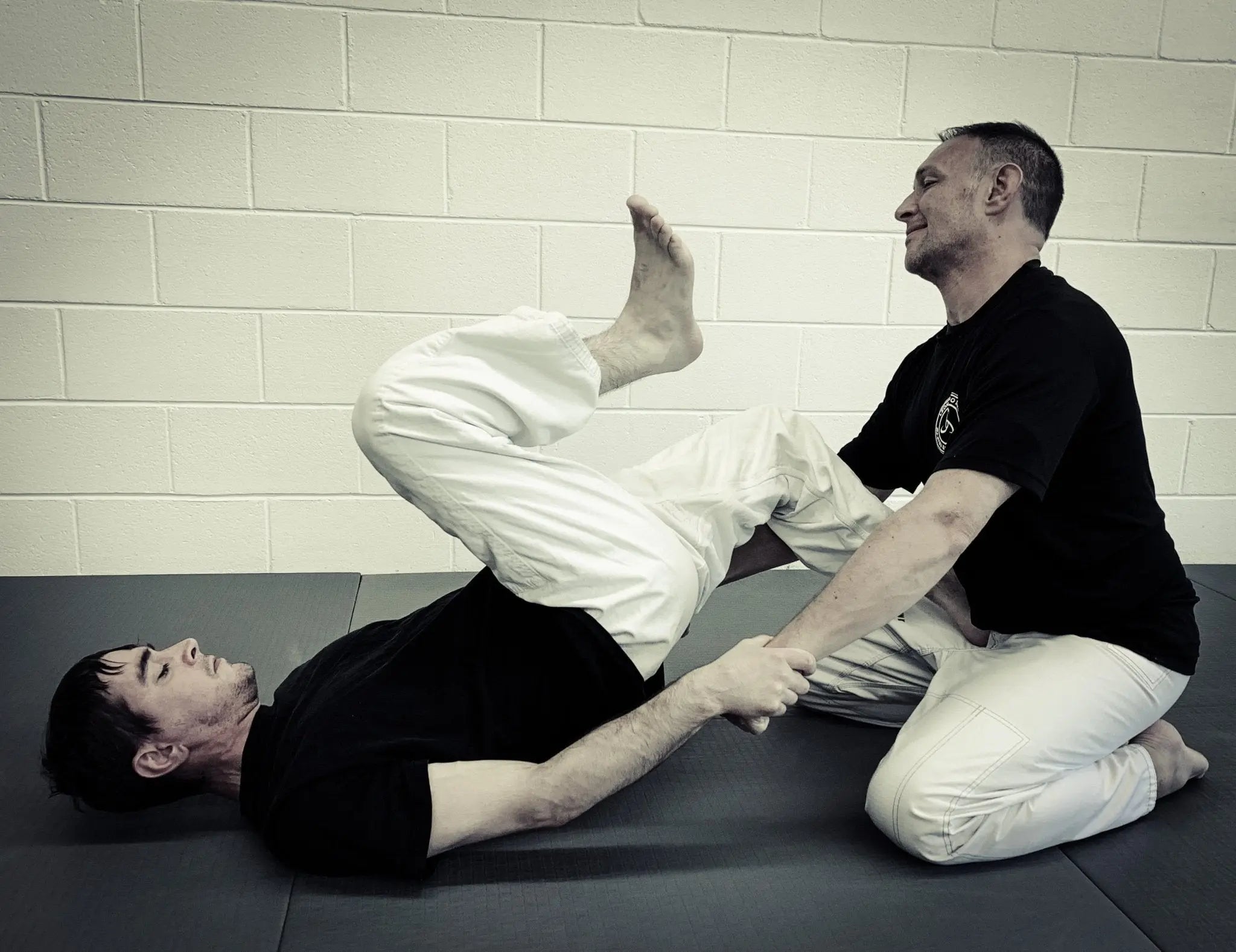 Jiu Jitsu Training: Private Self Defense Lesson at Main Street Collective. Grappling technique demonstration.
