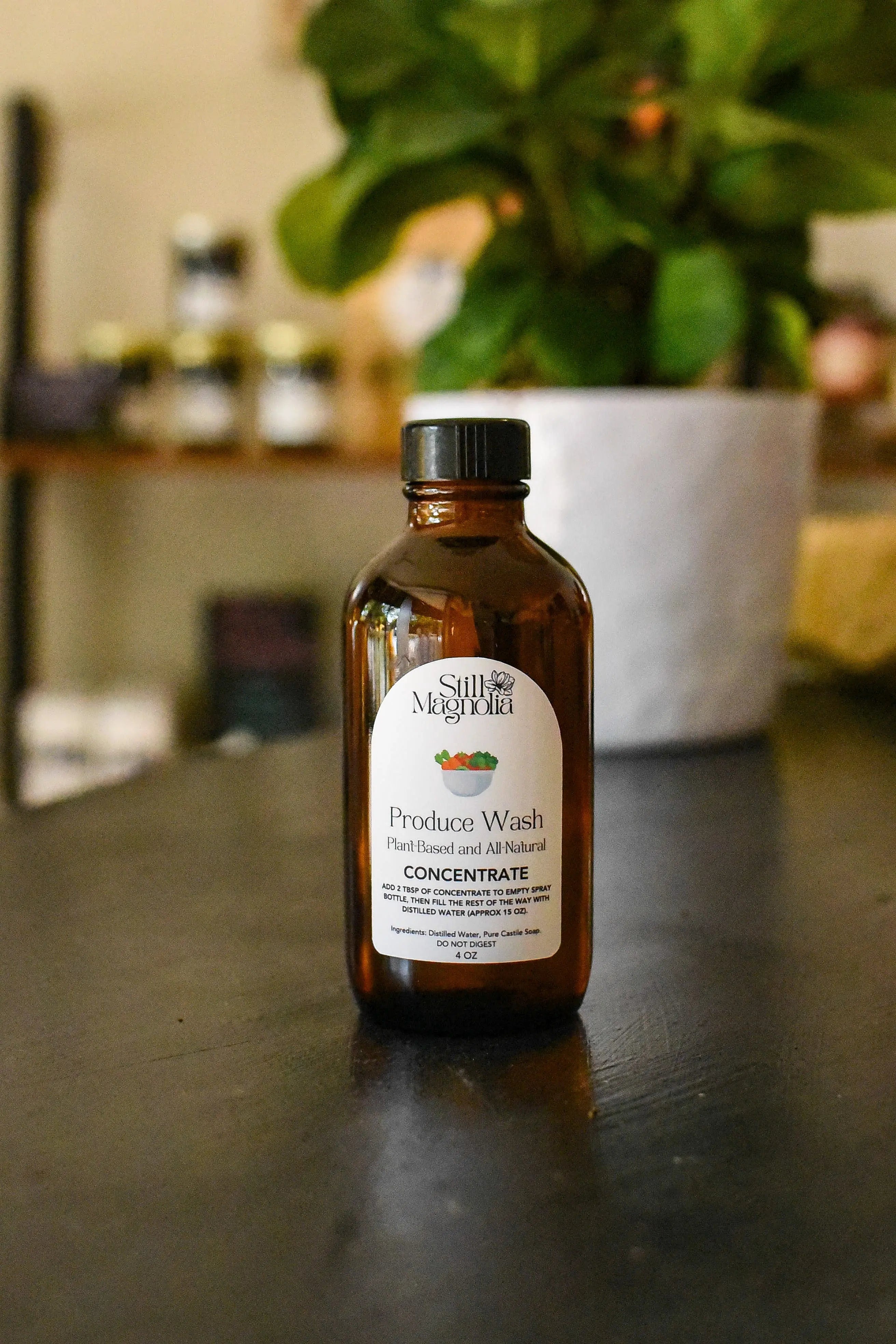 Still Magnolia Produce Wash concentrate bottle, 4 oz size.