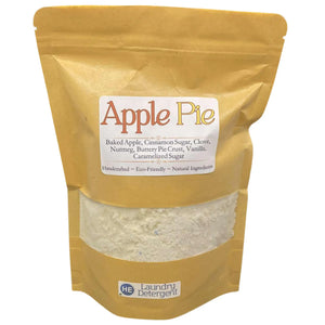 Apple Pie scented laundry detergent in a brown kraft paper bag with a transparent window showing the detergent powder.