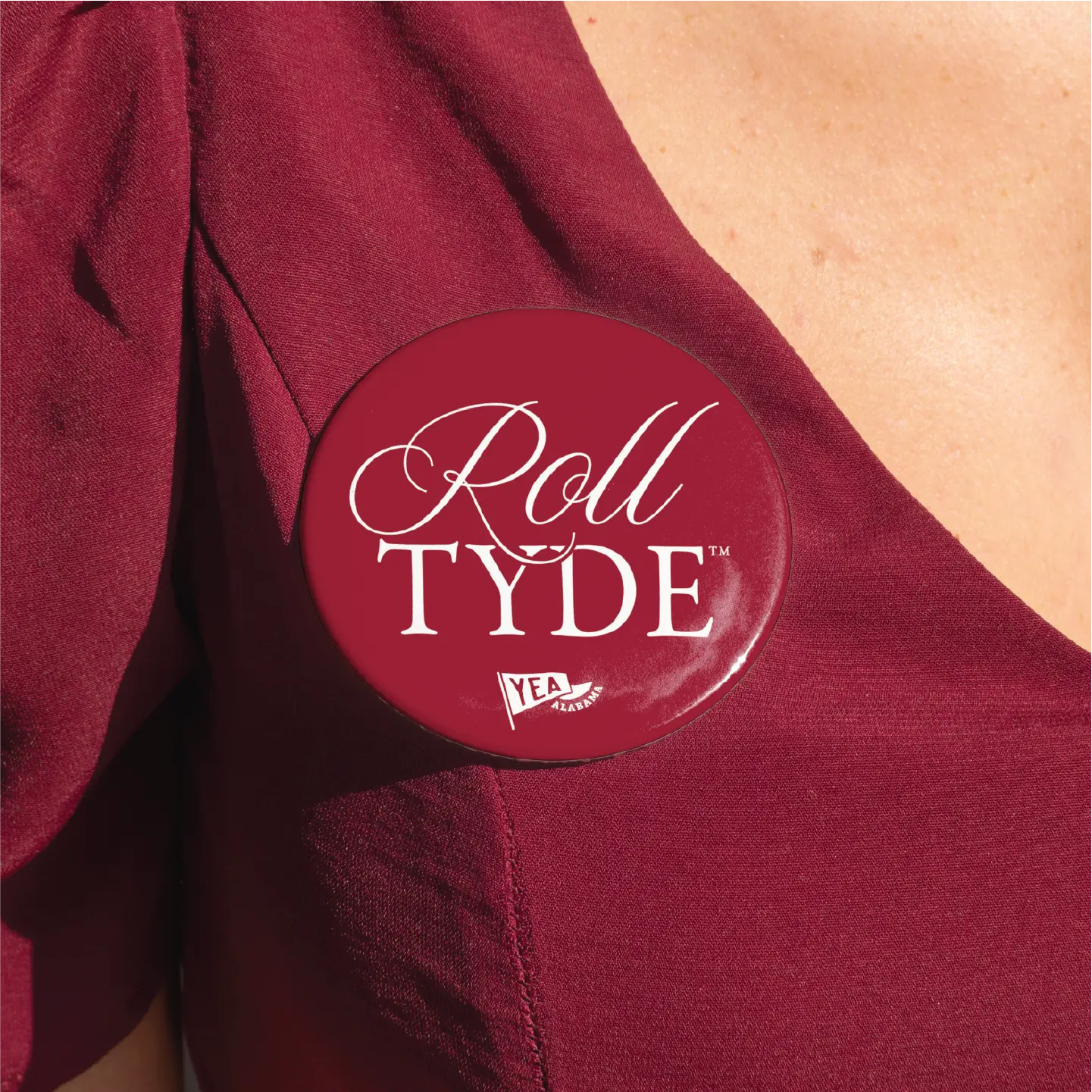 Roll Tyde Button with "Yea Alabama" flag on a maroon garment, showcasing Alabama pride with white lettering.
