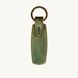 Green leather key ring with antique brass ring from Main Street Collective, featuring hand-stitched Horween Shell Cordovan.