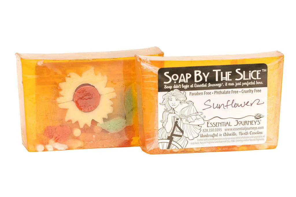 Essential Journeys sunflower glycerin soap bars with decorative elements.