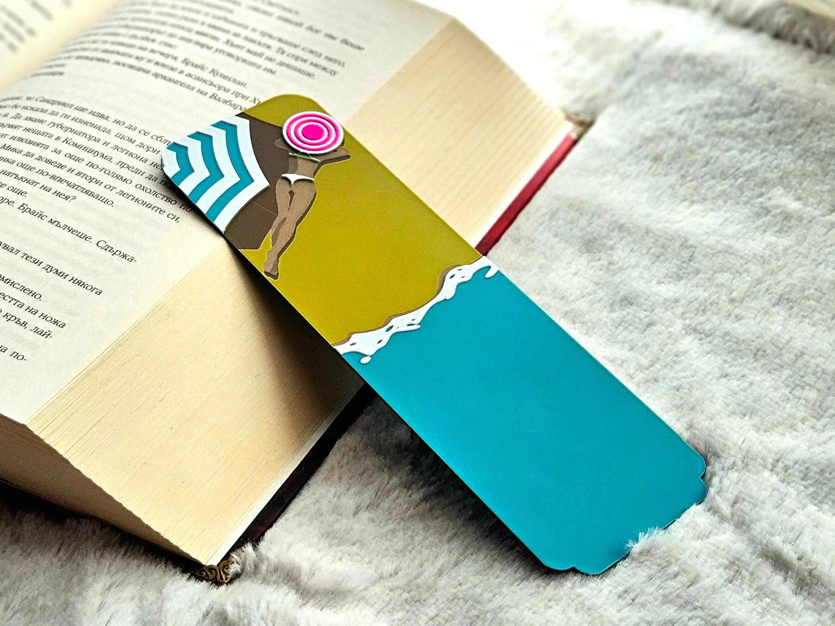 Seaside siesta bookmark with beach umbrella and ocean waves