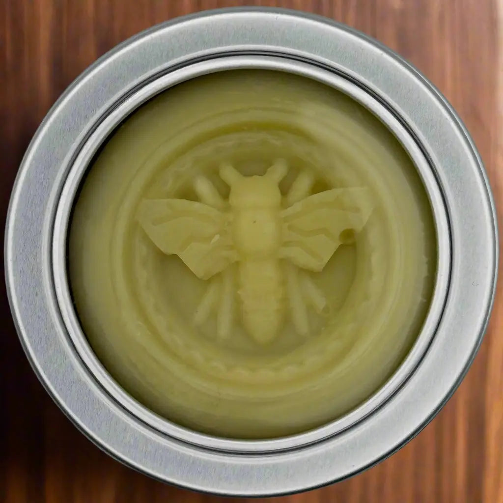 Beeswax lotion bar in a tin container, showcasing a bee design. Handmade lotion bar. Yellow lotion bar.