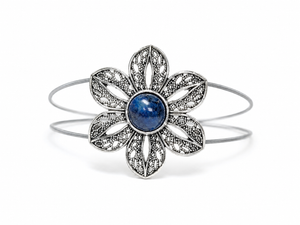 Silver bracelet with a blue gemstone on a white background