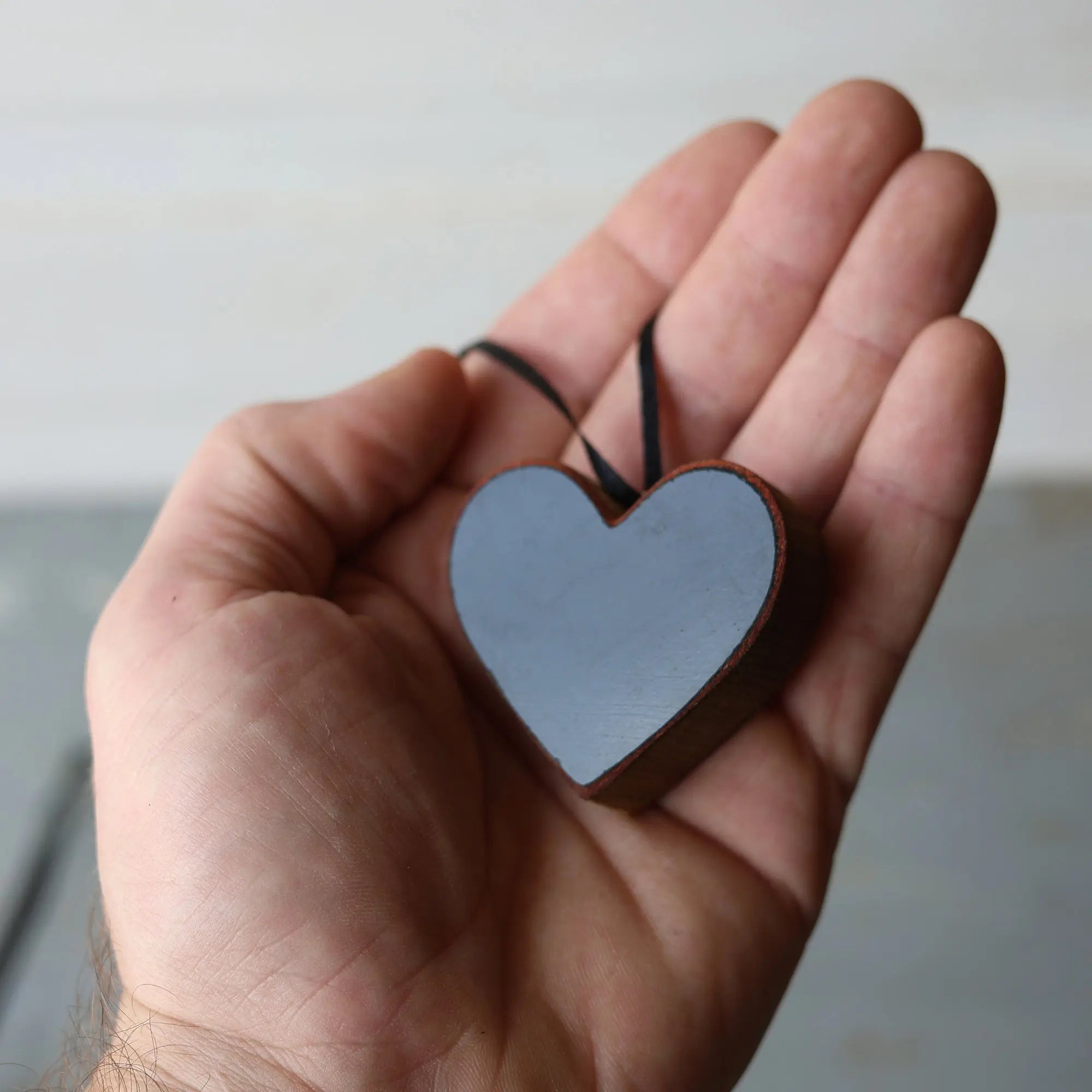 Reclaimed piano wood heart ornament with black ribbon hanger