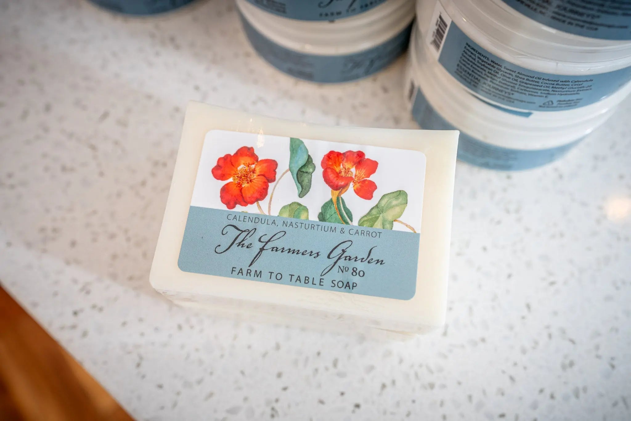 The Farmers Garden Farm to Table Soap with calendula, nasturtium & carrot on label.