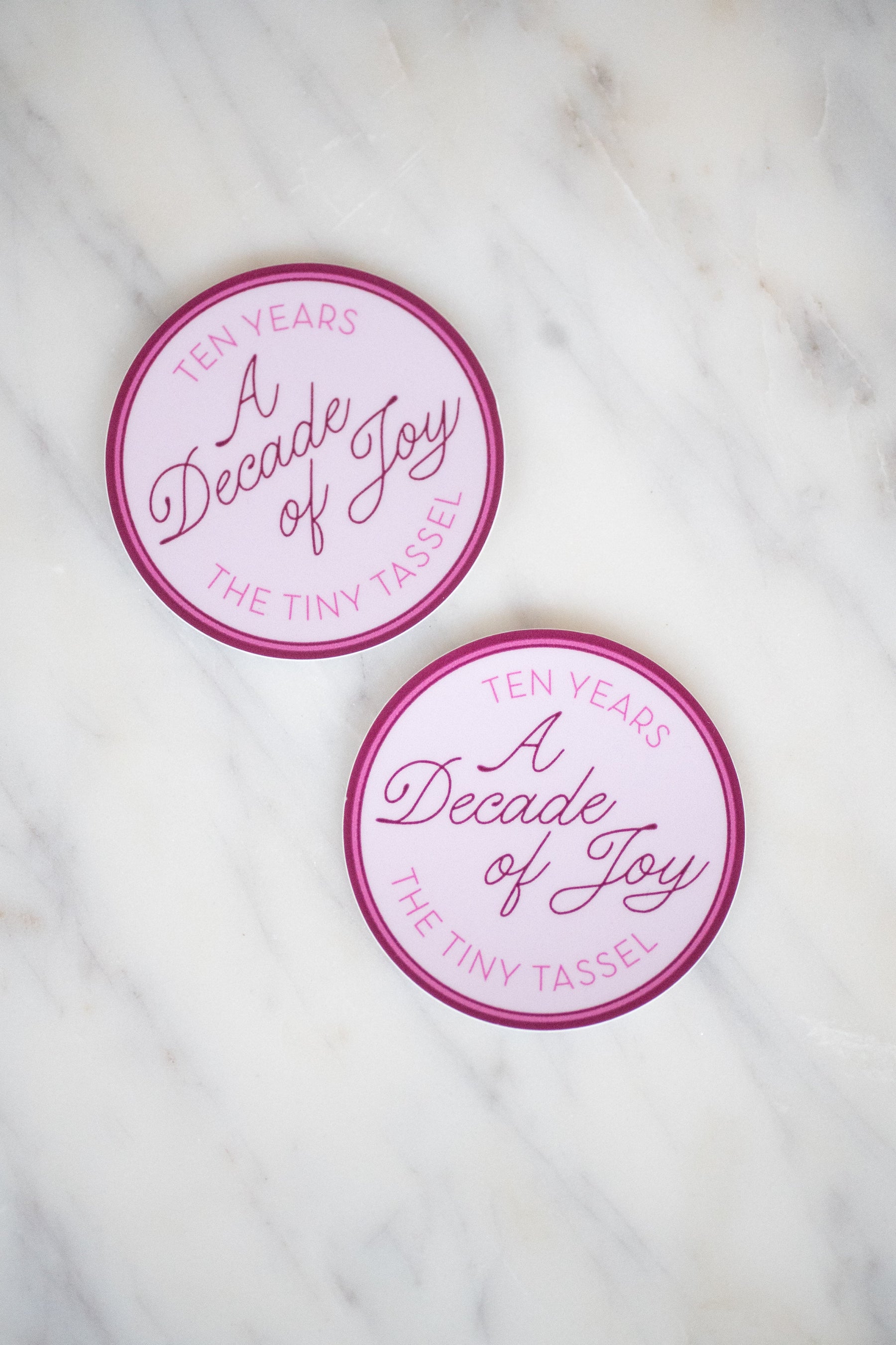 A Decade of Joy Sticker by The Tiny Tassel