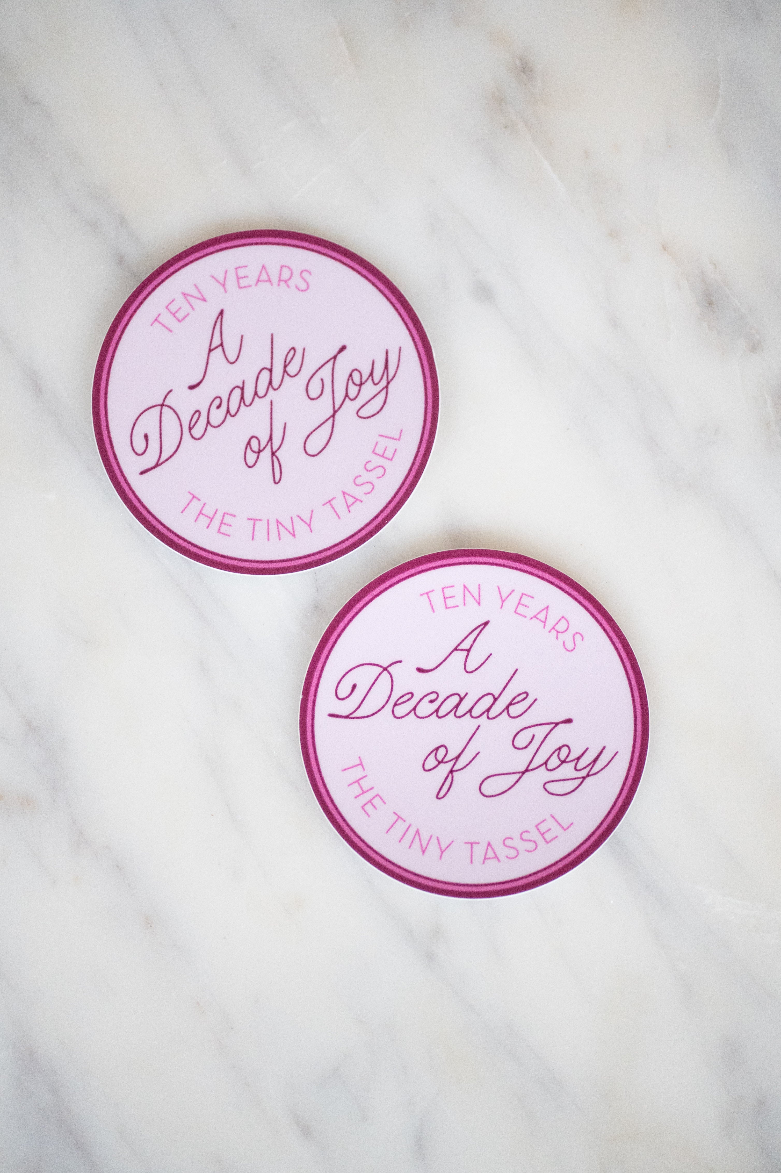 A Decade of Joy Sticker by The Tiny Tassel