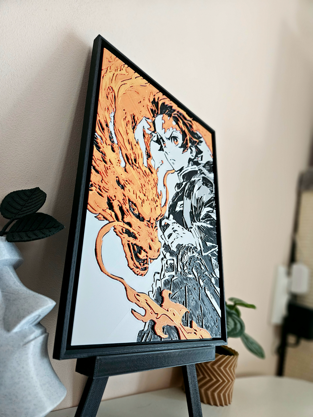 Tanjiro Demon Slayer filament painting on stand. Anime wall art of character with gold fire design.