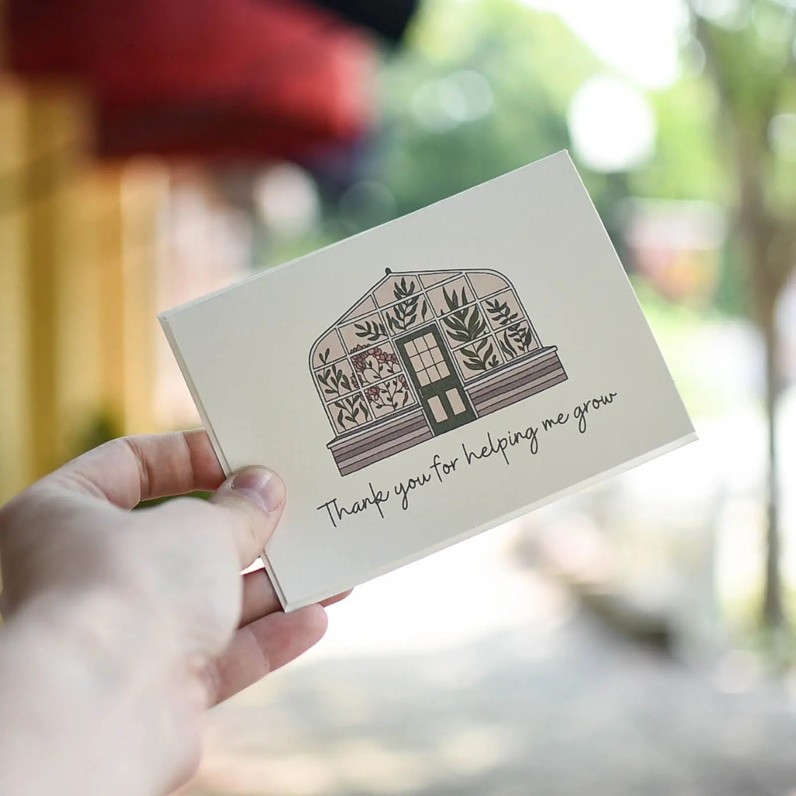 Greeting card with greenhouse illustration and "Thank you for helping me grow" text.