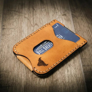 Brown leather card holder with "BULL SHEATH LEATHER" visible on a card.