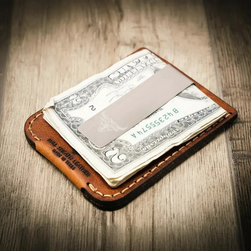Brown leather money clip wallet with dollar bills and a metal clip.