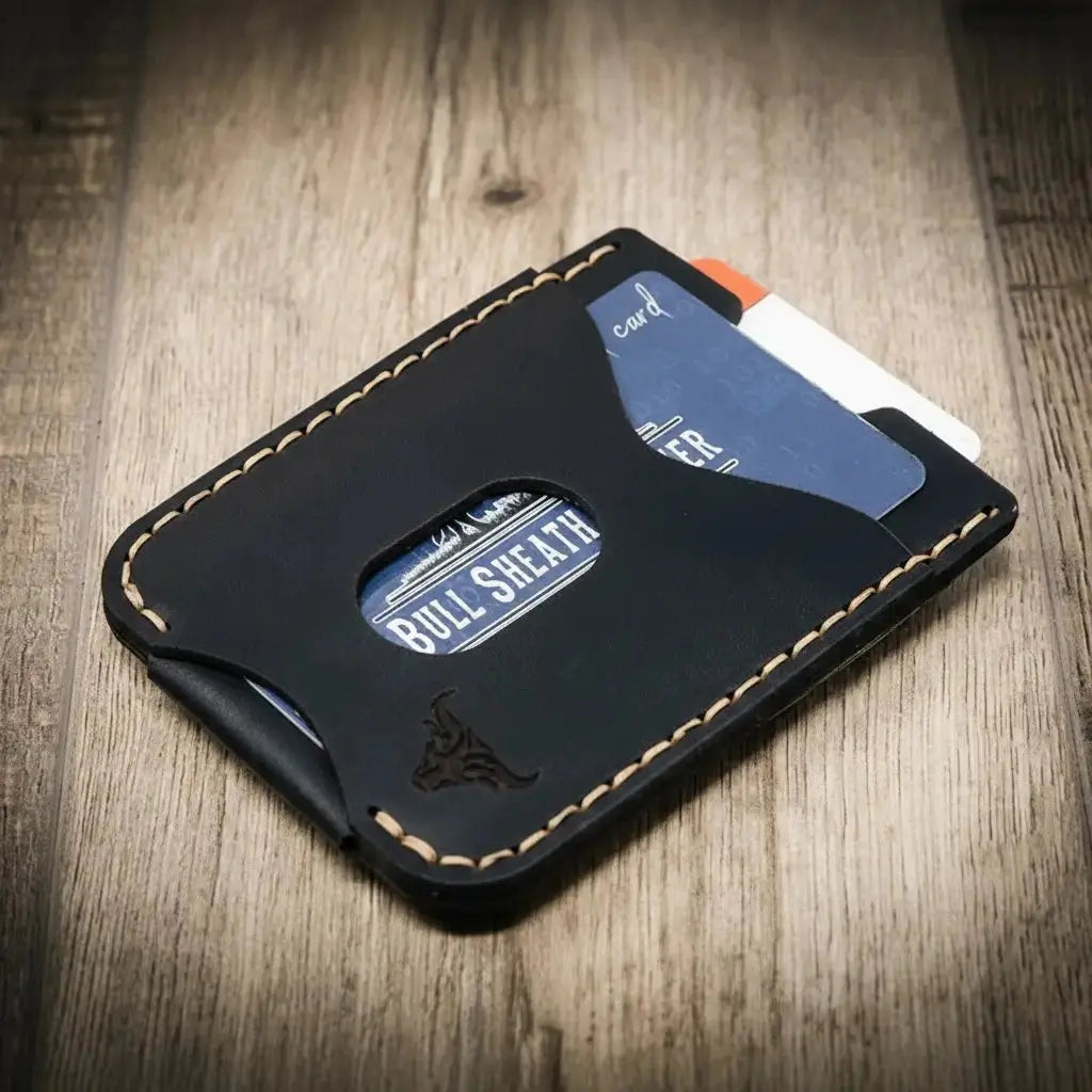 Black leather money clip wallet with card slots and bull logo.