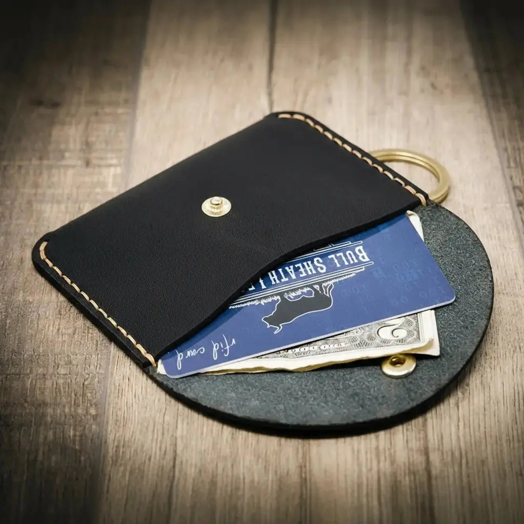 Black leather keychain wallet with card and cash